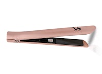 a rose gold hair straightener on a white background