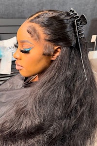 a woman is getting her hair done in a salon